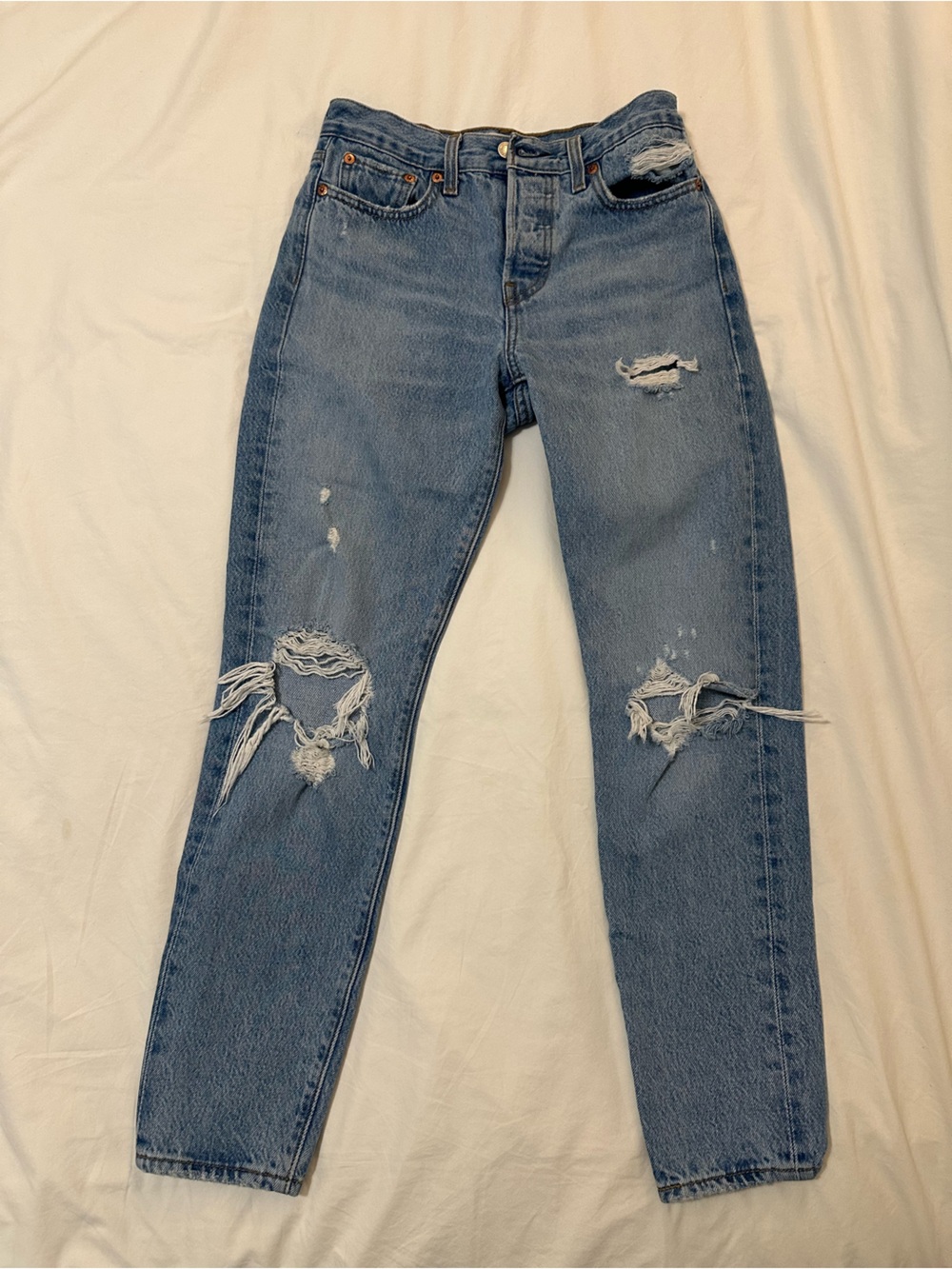 Light Wash Distressed Levi’s Straight-Leg Jeans